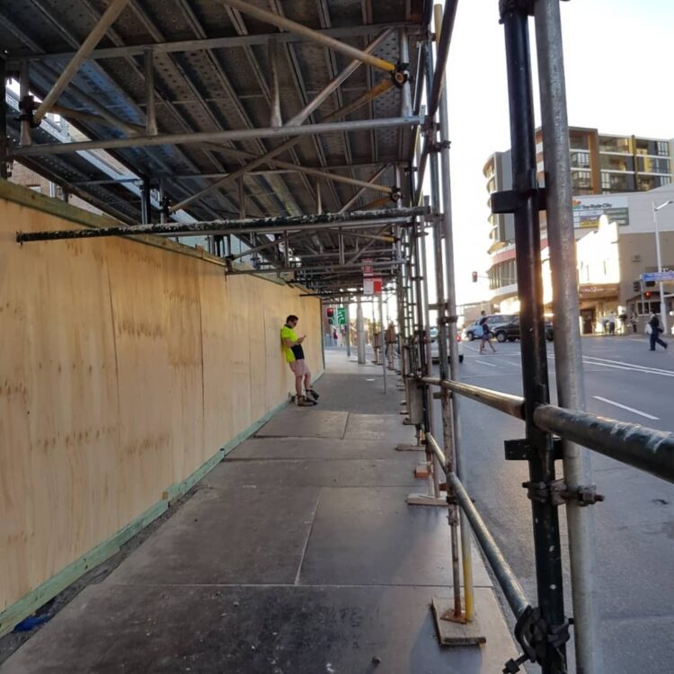 ALTA scaffolding staff inspecting scaffolding erected on commercial building site